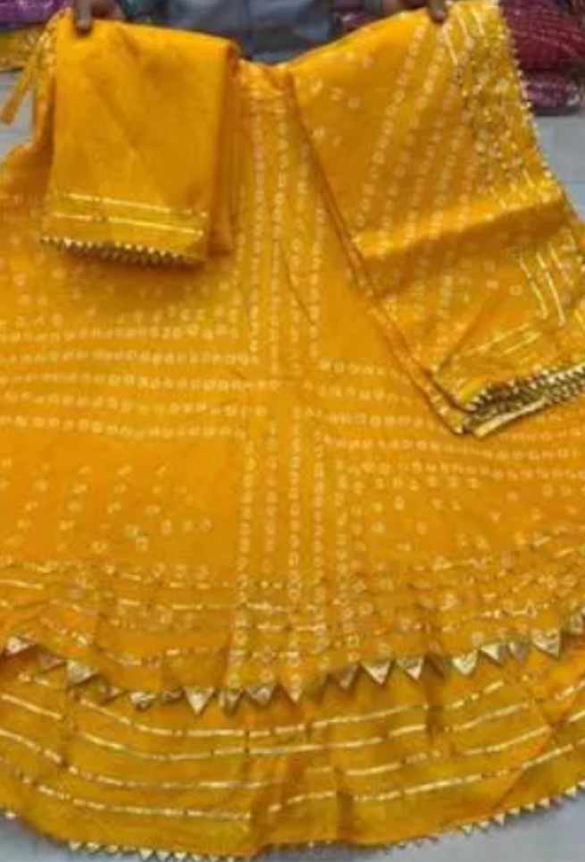 Buy Yellow Bandhani Lehenga Choli with Kota Doriya Gota Patti Border Online